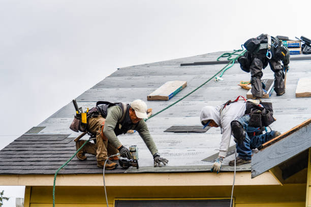 Professional Roofing technician working in Valley Falls, RI
